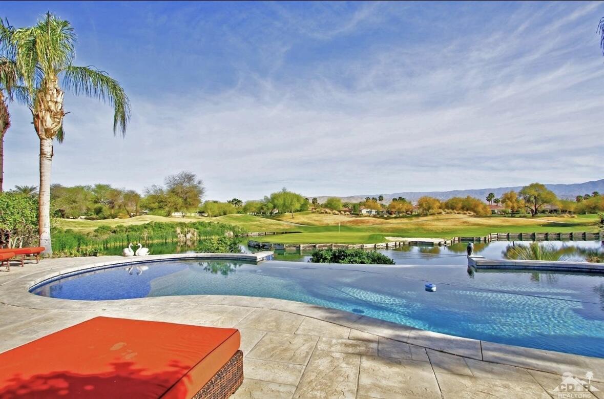 104 Loch Lomond Road Rancho Mirage, CA 92270 - Photo 10 of 27 a view of a swimming pool with an outdoor seating