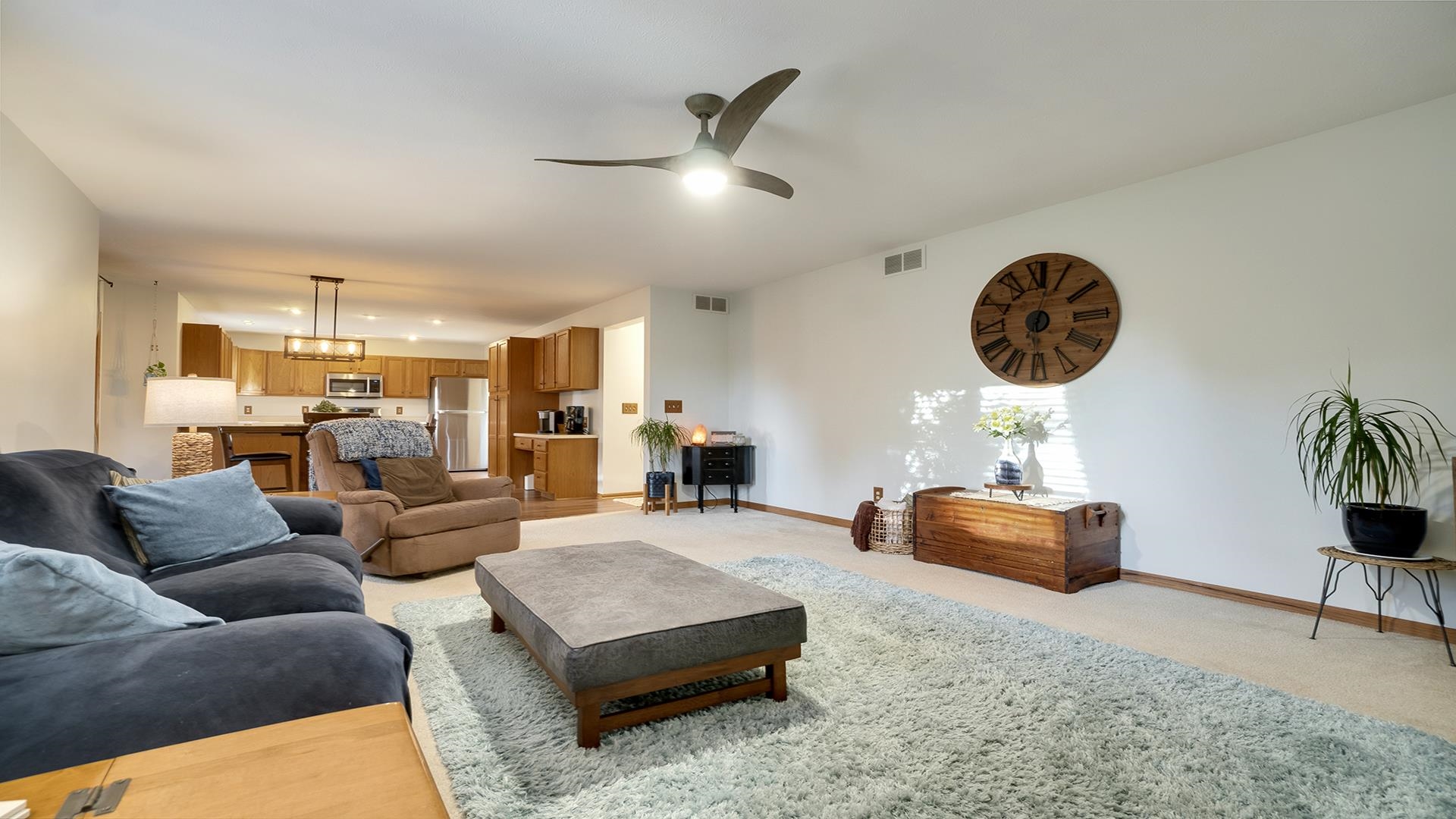 604 Commander Place Belvidere, IL 61008 - Photo 11 of 40 a living room with furniture and a clock