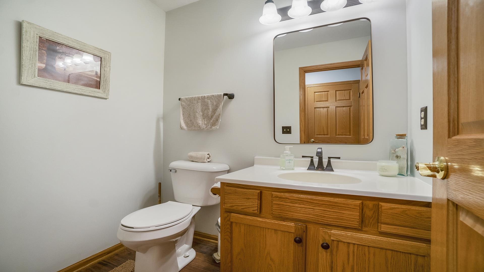 604 Commander Place Belvidere, IL 61008 - Photo 20 of 40 a bathroom with a toilet sink and mirror