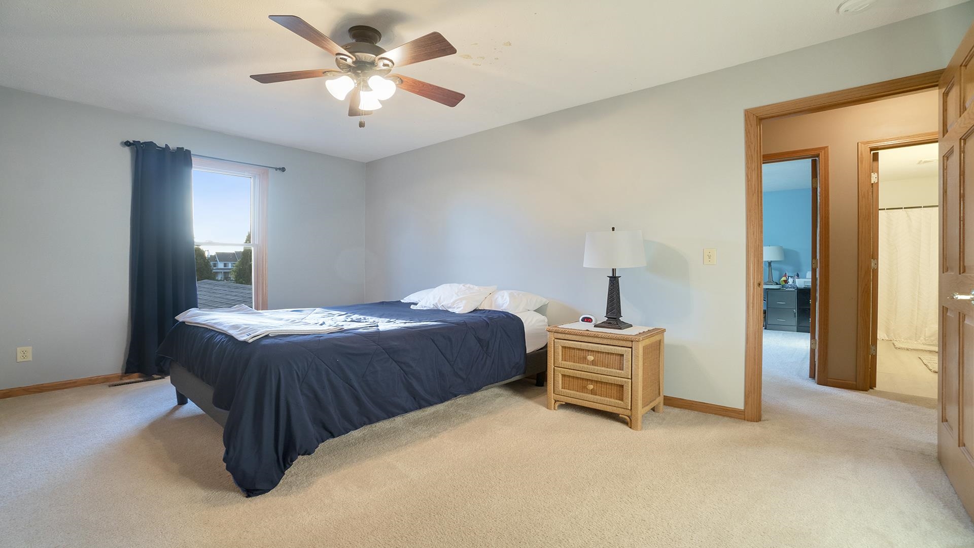 604 Commander Place Belvidere, IL 61008 - Photo 22 of 40 a bedroom with a bed and a chandelier