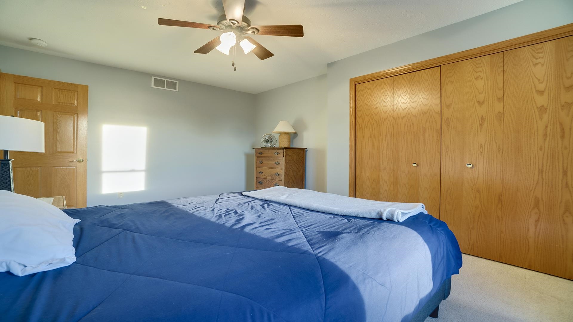 604 Commander Place Belvidere, IL 61008 - Photo 24 of 40 a bedroom with a bed and a chandelier