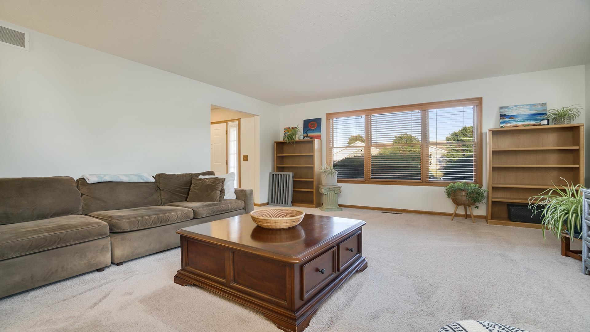 604 Commander Place Belvidere, IL 61008 - Photo 9 of 40 a living room with furniture and a large window