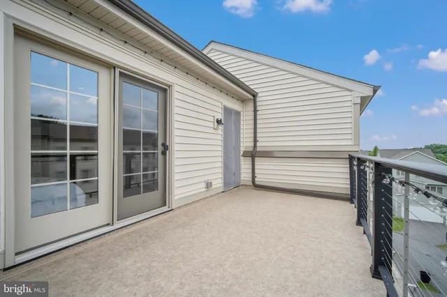 a view of an empty room with closet