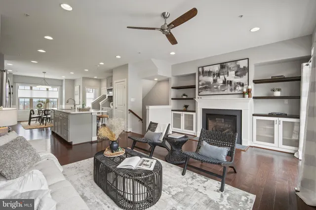 a living room with furniture or kitchen and a fireplace