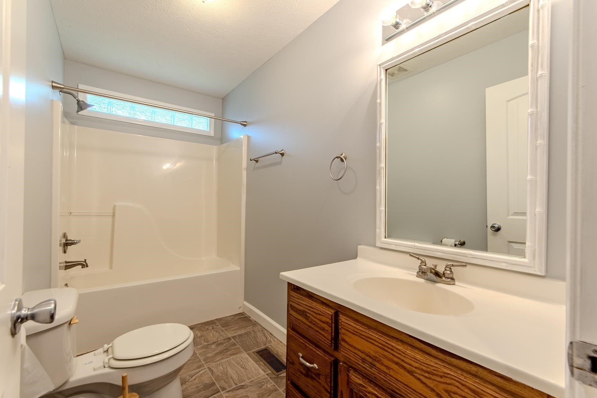 150 Hollis Way Adamsville, TN 38310 - Photo 16 of 37 a bathroom with a sink and a mirror
