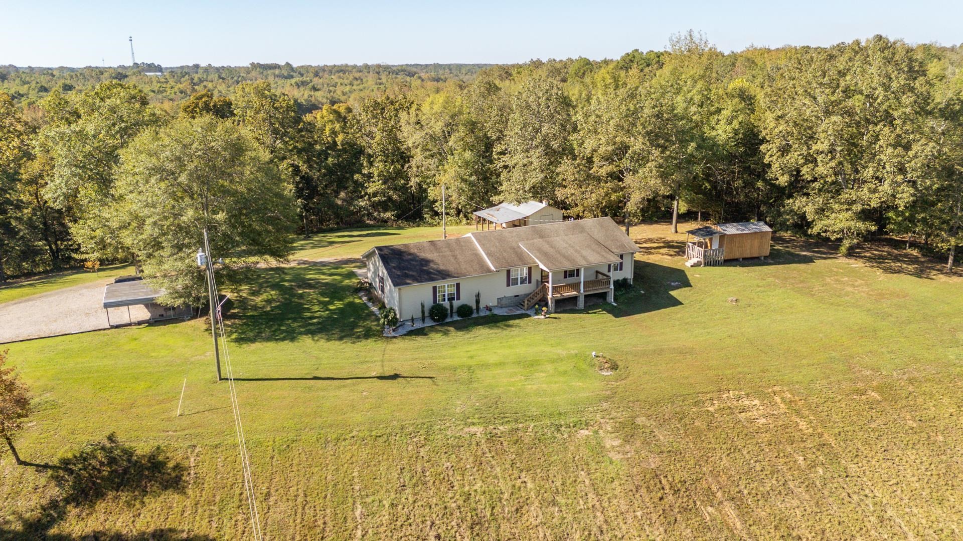 150 Hollis Way Adamsville, TN 38310 - Photo 2 of 37 a view of a lake with houses