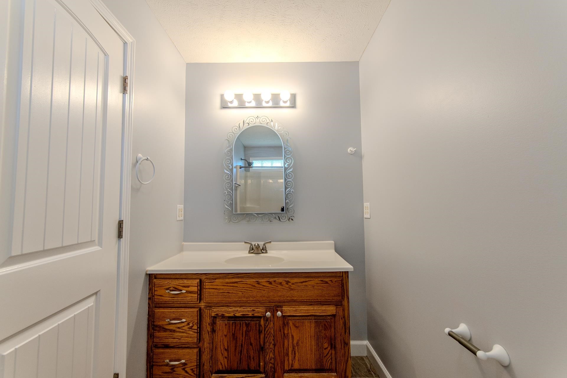 150 Hollis Way Adamsville, TN 38310 - Photo 22 of 37 a bathroom with a sink and a mirror