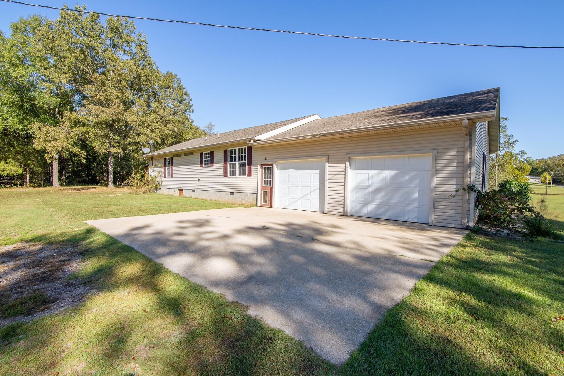 150 Hollis Way Adamsville, TN 38310 - Photo 28 of 37 a front view of house with yard and green space