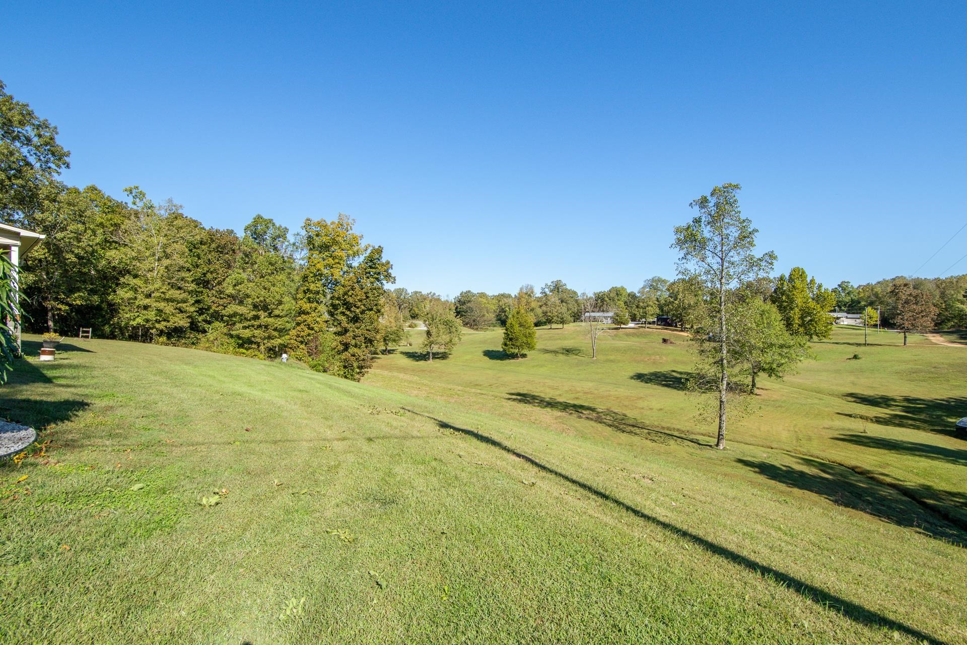 150 Hollis Way Adamsville, TN 38310 - Photo 4 of 37 a view of a big yard with an outdoor space