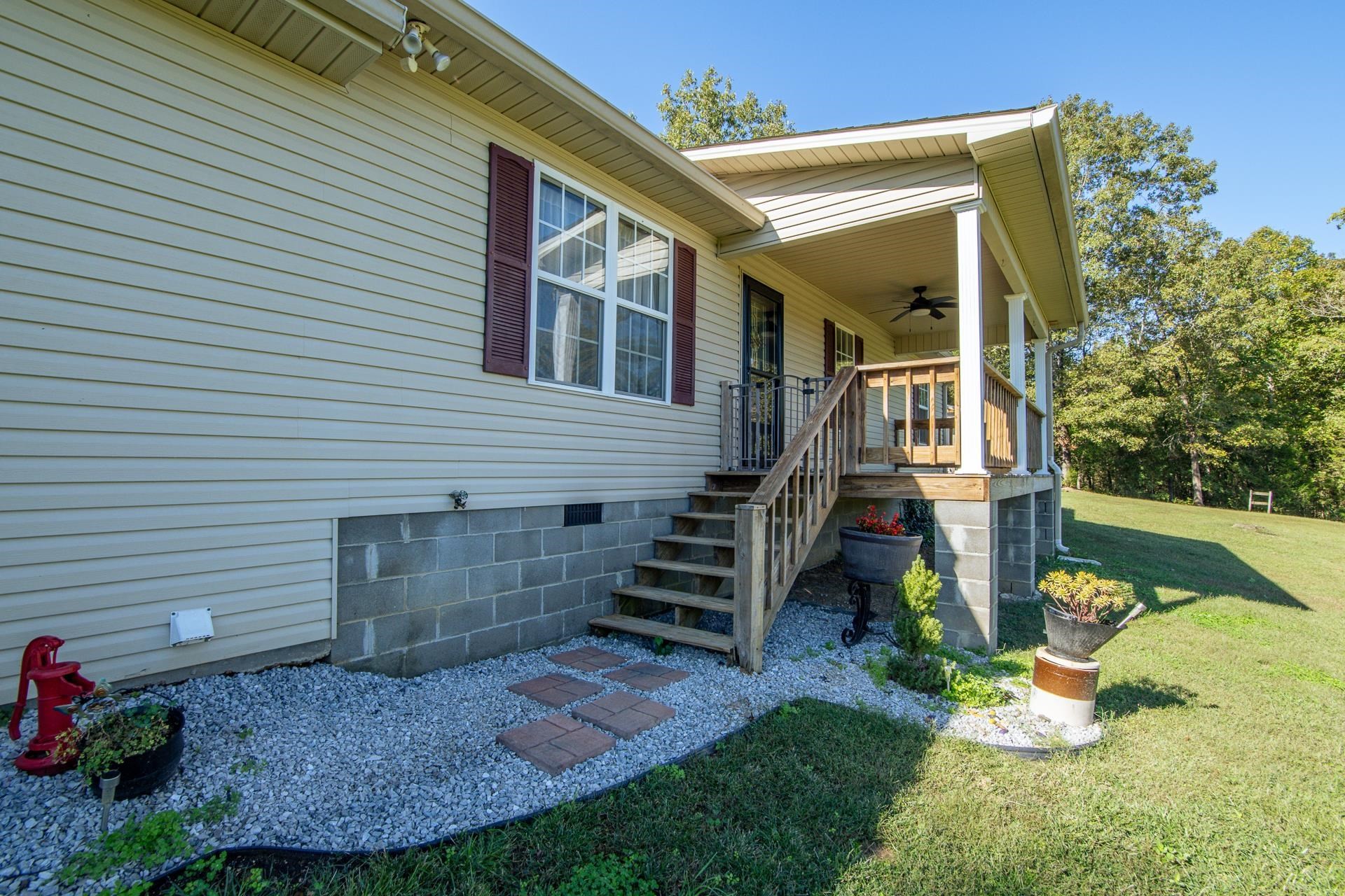 150 Hollis Way Adamsville, TN 38310 - Photo 6 of 37 a view of a house with backyard and garden