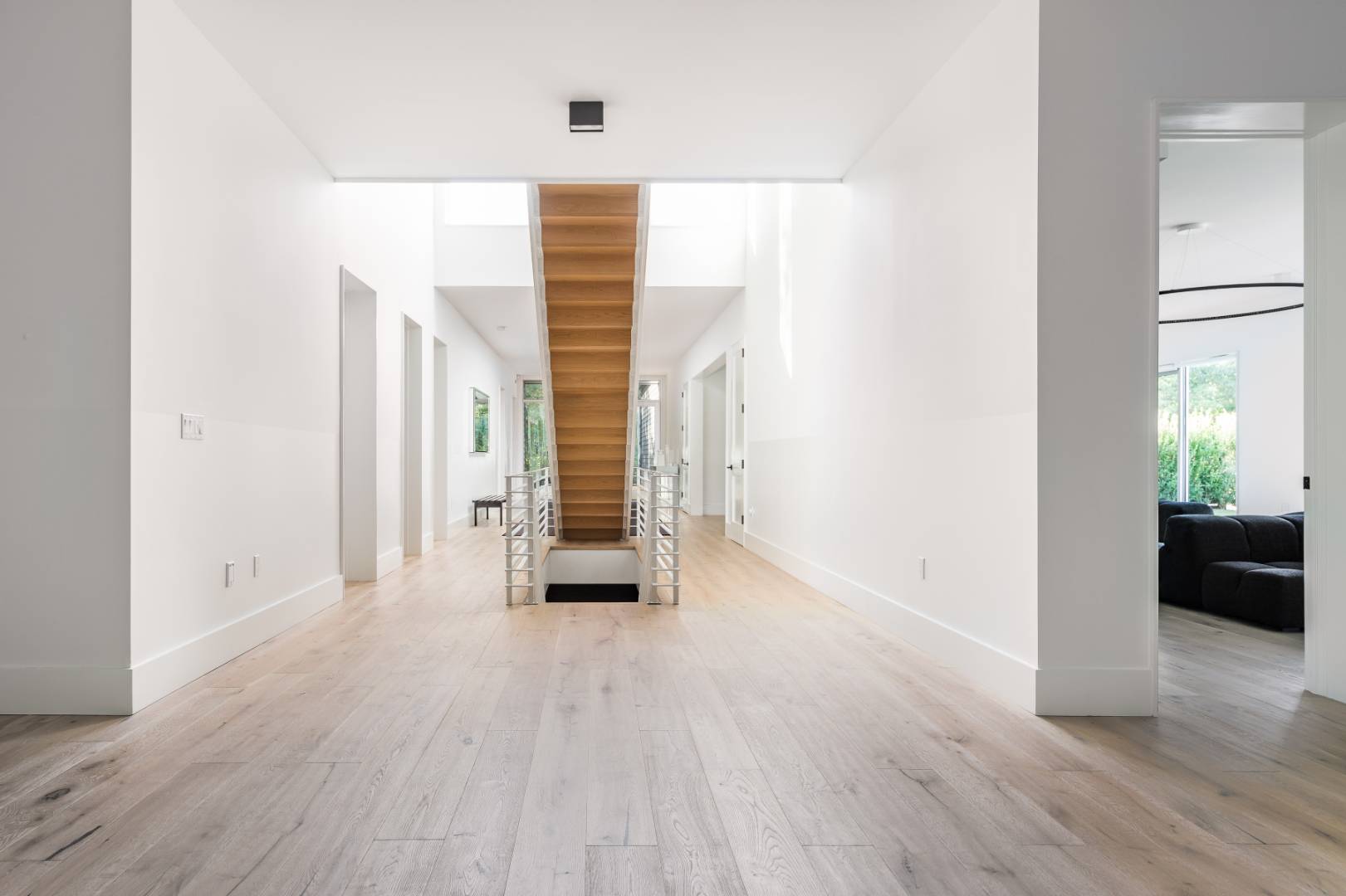 42 Old Noyack Path Sag Harbor, NY 11963 - Photo 16 of 43 an empty room with wooden floor and windows