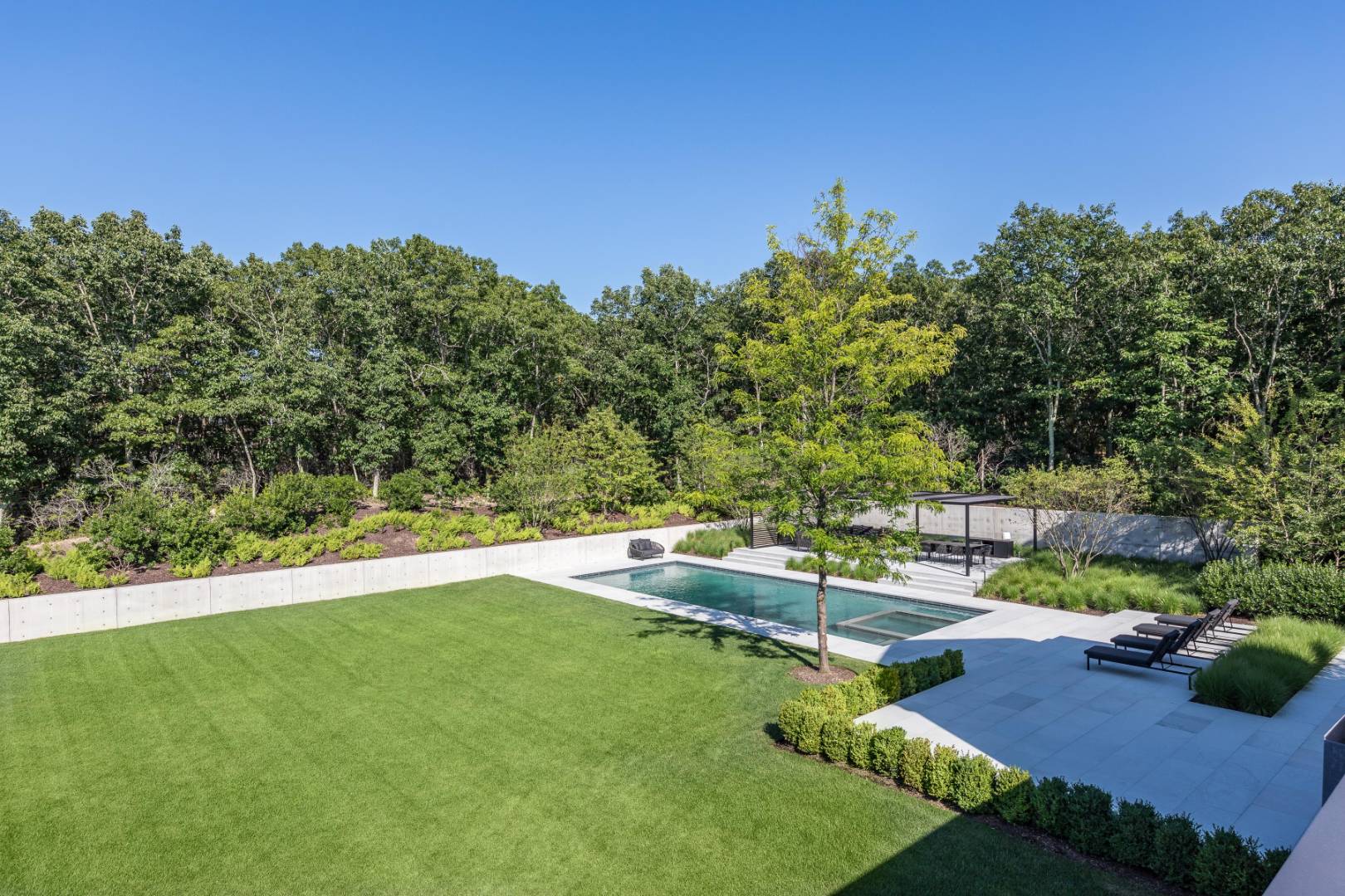42 Old Noyack Path Sag Harbor, NY 11963 - Photo 22 of 43 a view of a backyard with swimming pool