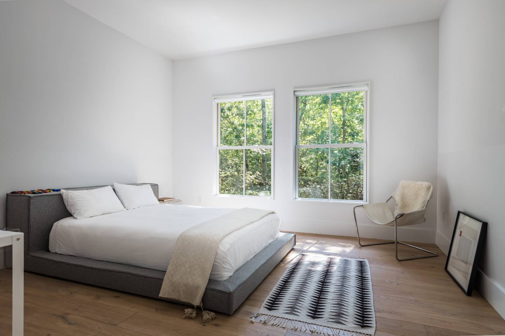 42 Old Noyack Path Sag Harbor, NY 11963 - Photo 27 of 43 a bedroom with a bed and a window