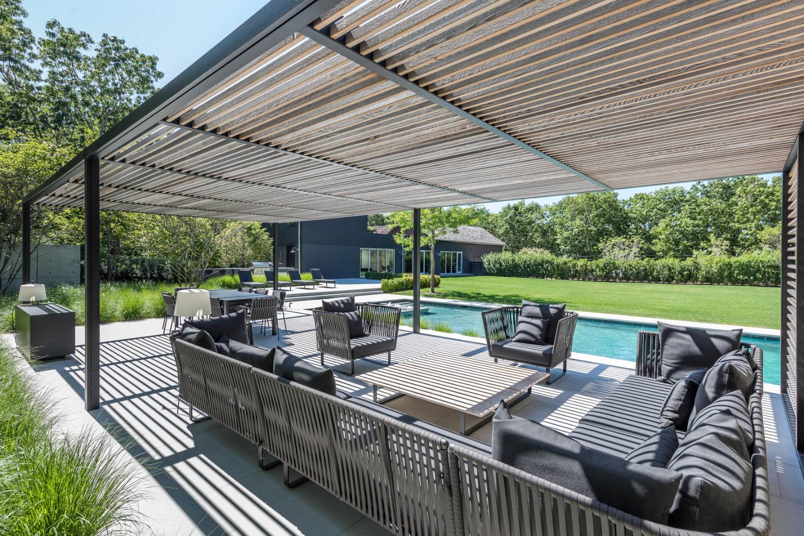 42 Old Noyack Path Sag Harbor, NY 11963 - Photo 34 of 43 a view of a patio with couches chairs and a table