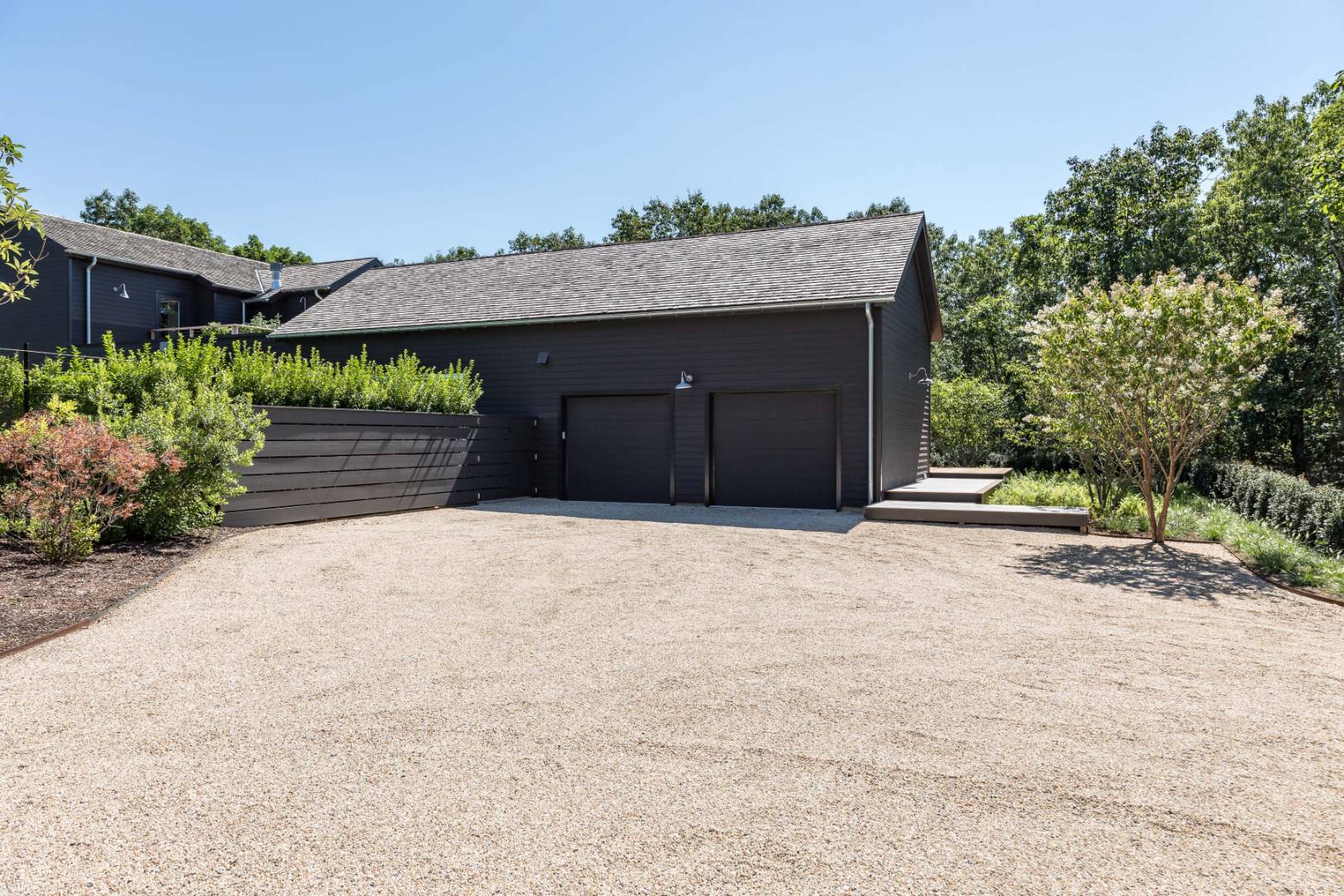 42 Old Noyack Path Sag Harbor, NY 11963 - Photo 35 of 43 a front view of a house with a yard and garage