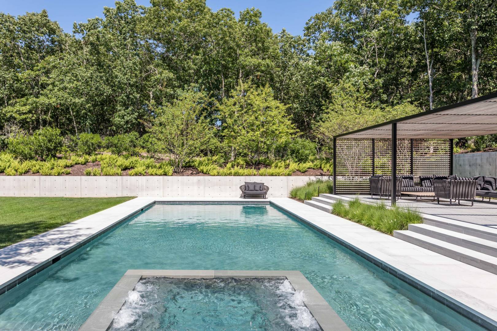 42 Old Noyack Path Sag Harbor, NY 11963 - Photo 38 of 43 a view of a backyard with a patio and a garden