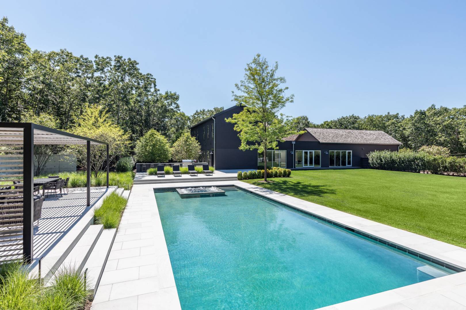42 Old Noyack Path Sag Harbor, NY 11963 - Photo 39 of 43 a view of swimming pool with a garden