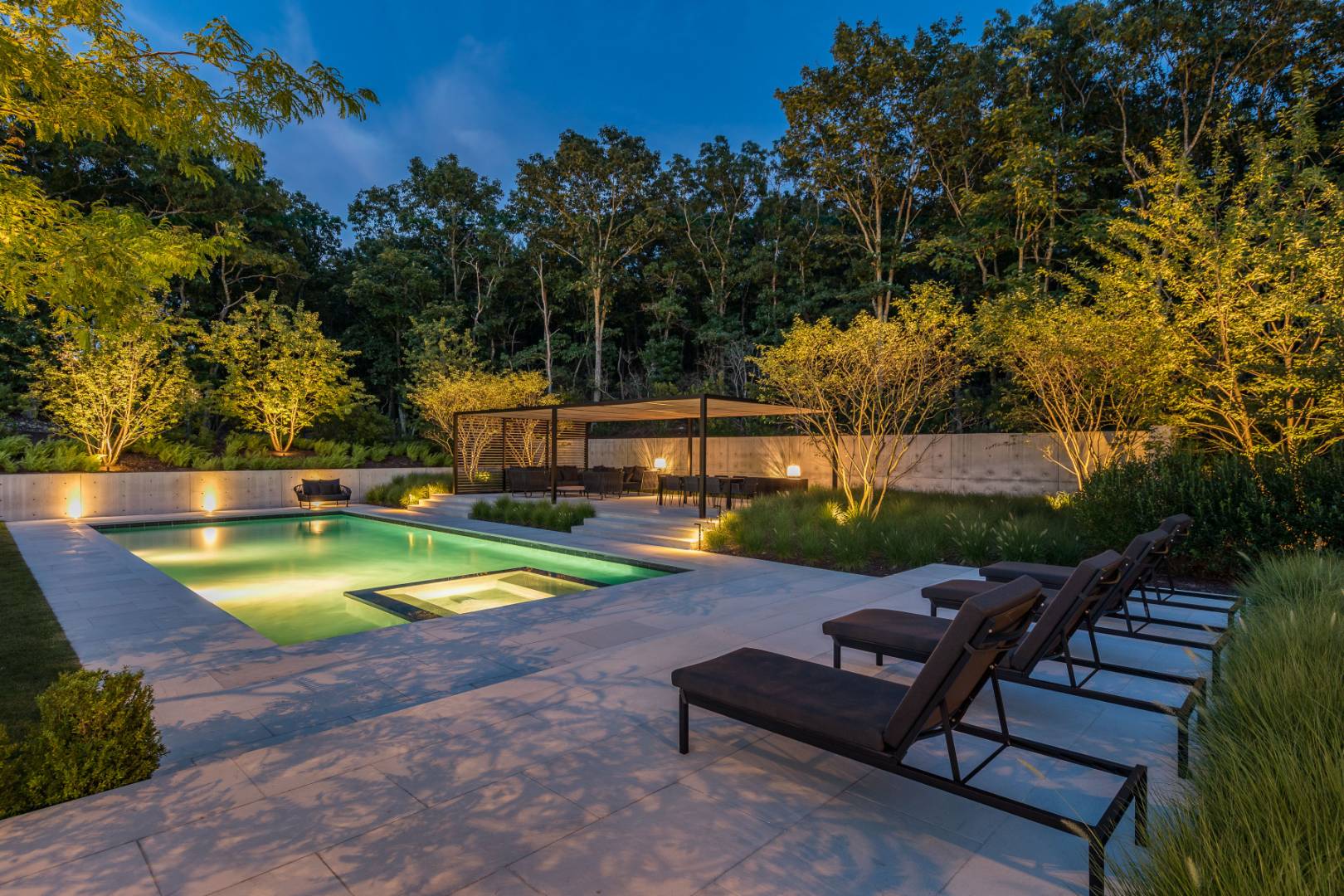 42 Old Noyack Path Sag Harbor, NY 11963 - Photo 5 of 43 a view of a swimming pool with a lounge chair and a small yard