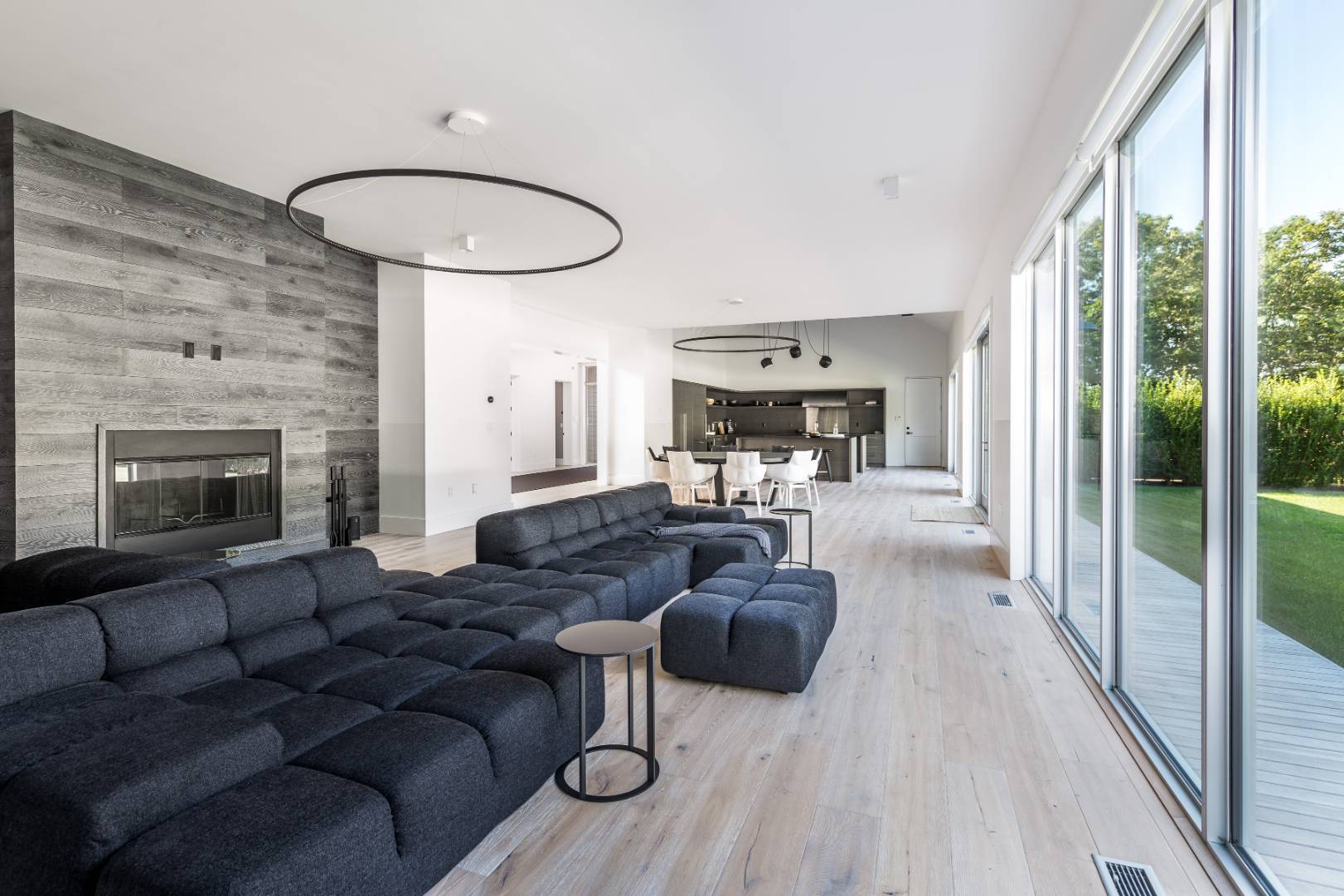 42 Old Noyack Path Sag Harbor, NY 11963 - Photo 9 of 43 a living room with furniture wooden floor and a fireplace