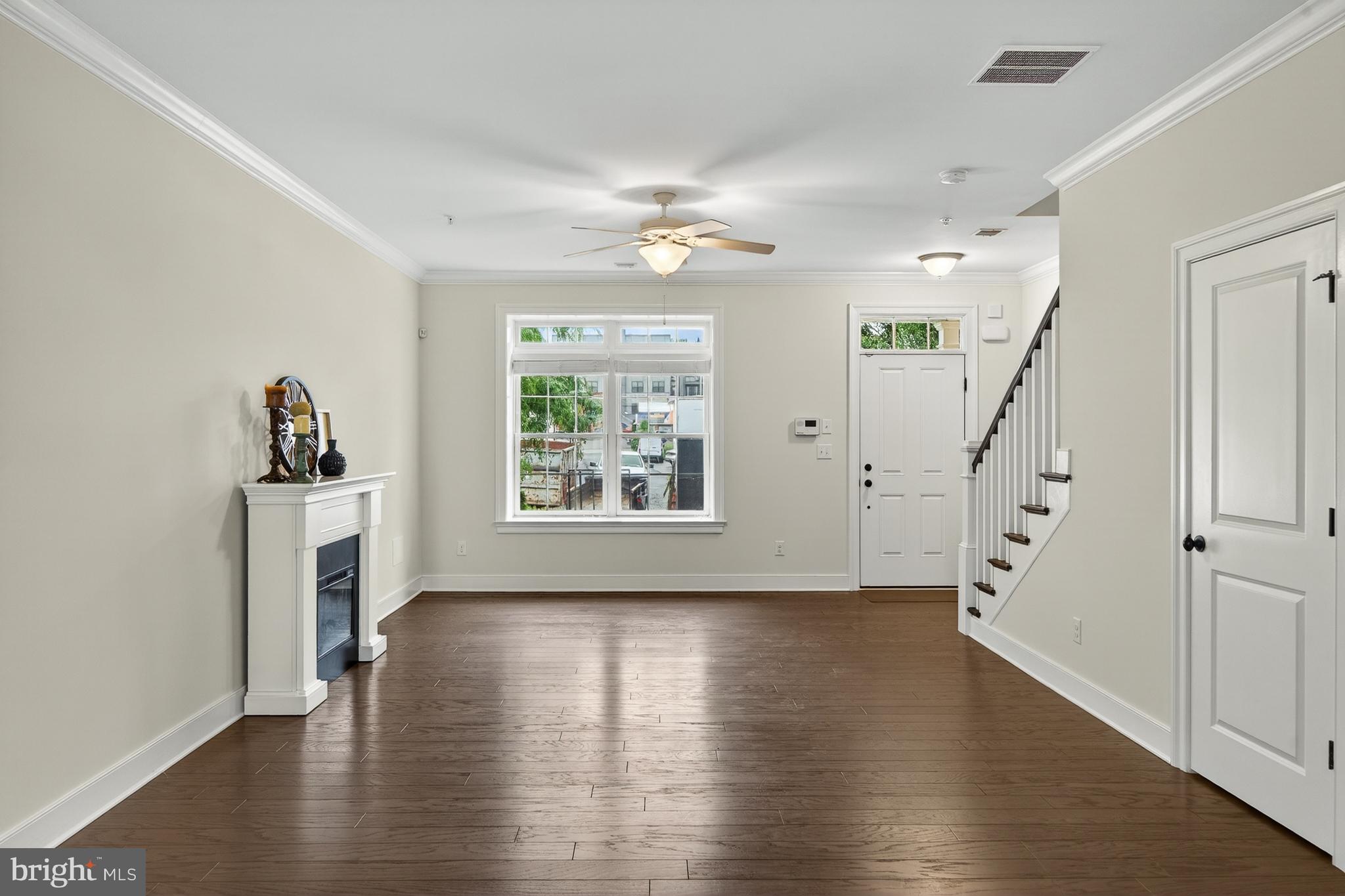 610 D Street Kennett Square, PA 19348 - Photo 3 of 24 Light filled great room with electric fireplace