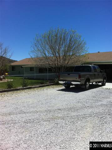 1383 Antelope Valley Road Reno, NV 89506 - Photo 1 of 13 a front view of a house with a yard