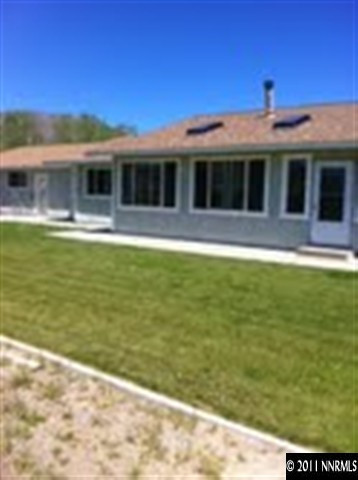 1383 Antelope Valley Road Reno, NV 89506 - Photo 13 of 13 a front view of a house with a garden
