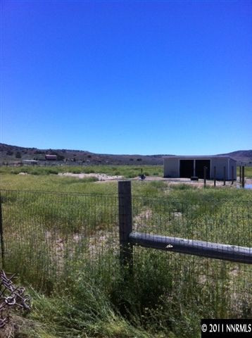 1383 Antelope Valley Road Reno, NV 89506 - Photo 10 of 13 a view of a lake with a yard