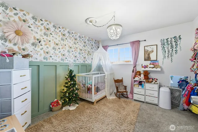 a spacious bathroom with a granite countertop toilet sink and mirror