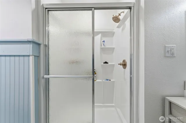 a bedroom with a bed and a table in it