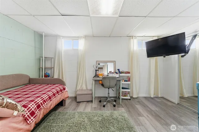 a bedroom with furniture and a book shelf