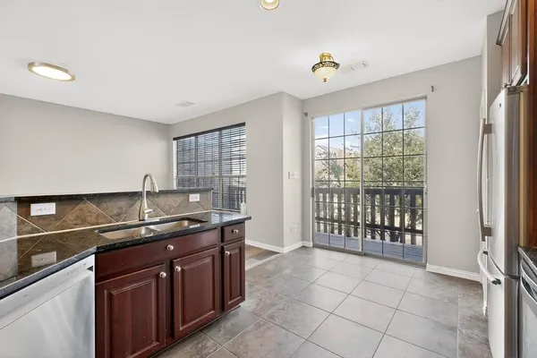 a kitchen with a sink and cabinets