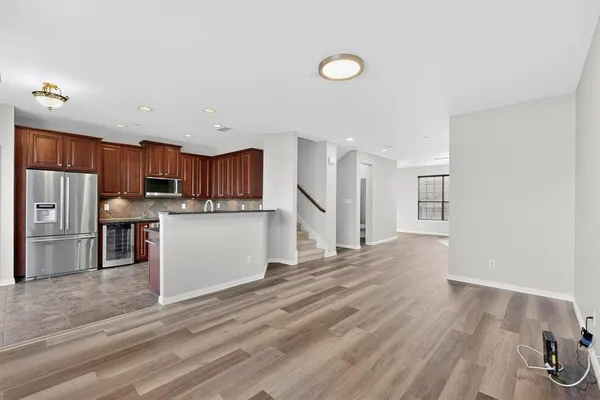 a view of kitchen with wooden floor