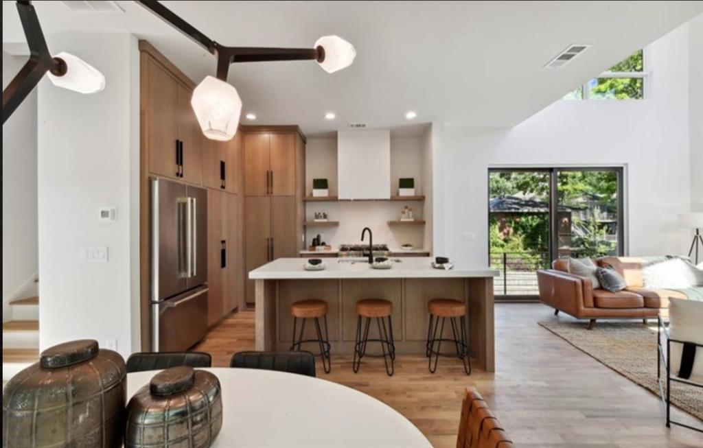 536 Highland Avenue Northeast, Unit B Atlanta, GA 30312 - Photo 15 of 62 a kitchen with a sink stainless steel appliances and furniture