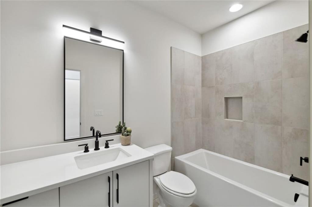 536 Highland Avenue Northeast, Unit B Atlanta, GA 30312 - Photo 30 of 62 a bathroom with a sink a toilet and shower