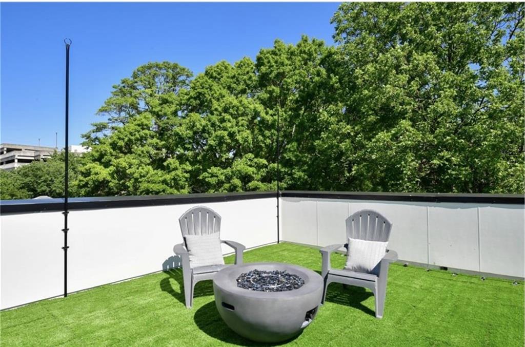 536 Highland Avenue Northeast, Unit B Atlanta, GA 30312 - Photo 35 of 62 a view of an outdoor sitting area in a backyard