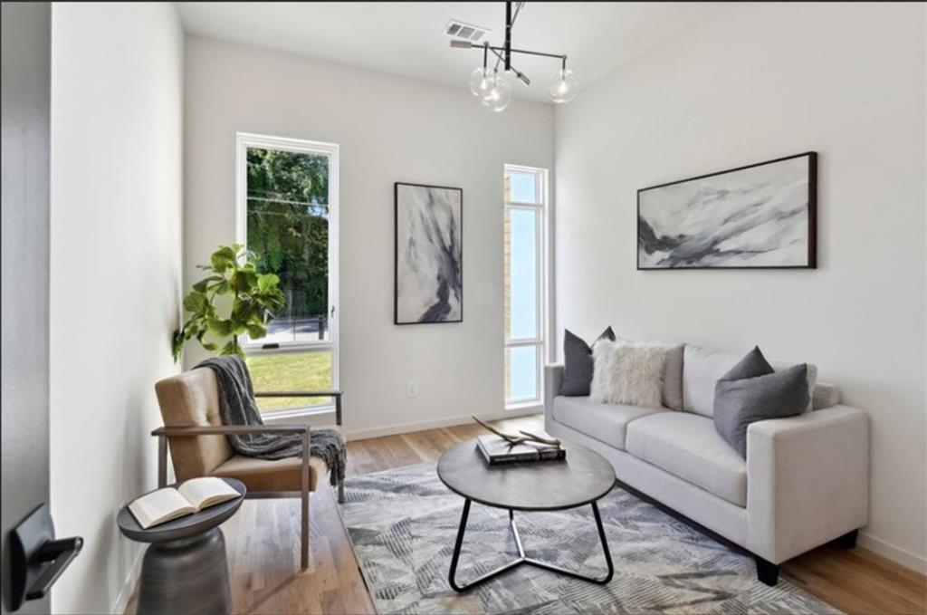 536 Highland Avenue Northeast, Unit B Atlanta, GA 30312 - Photo 7 of 62 a living room with furniture and a painting on the wall