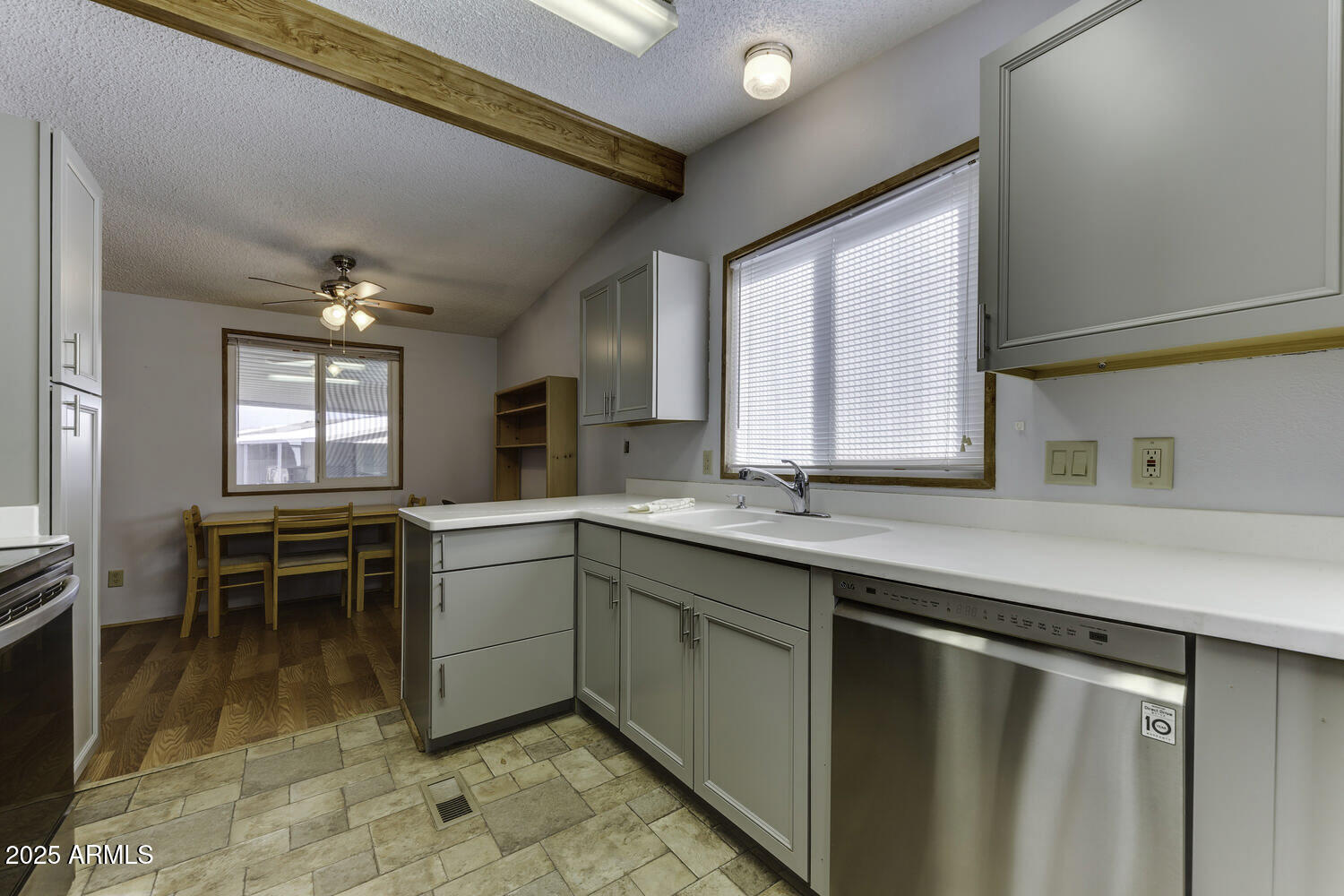 17200 West Bell Road, Unit 1745 Surprise, AZ 85374 - Photo 15 of 24 a kitchen with appliances cabinets and chair