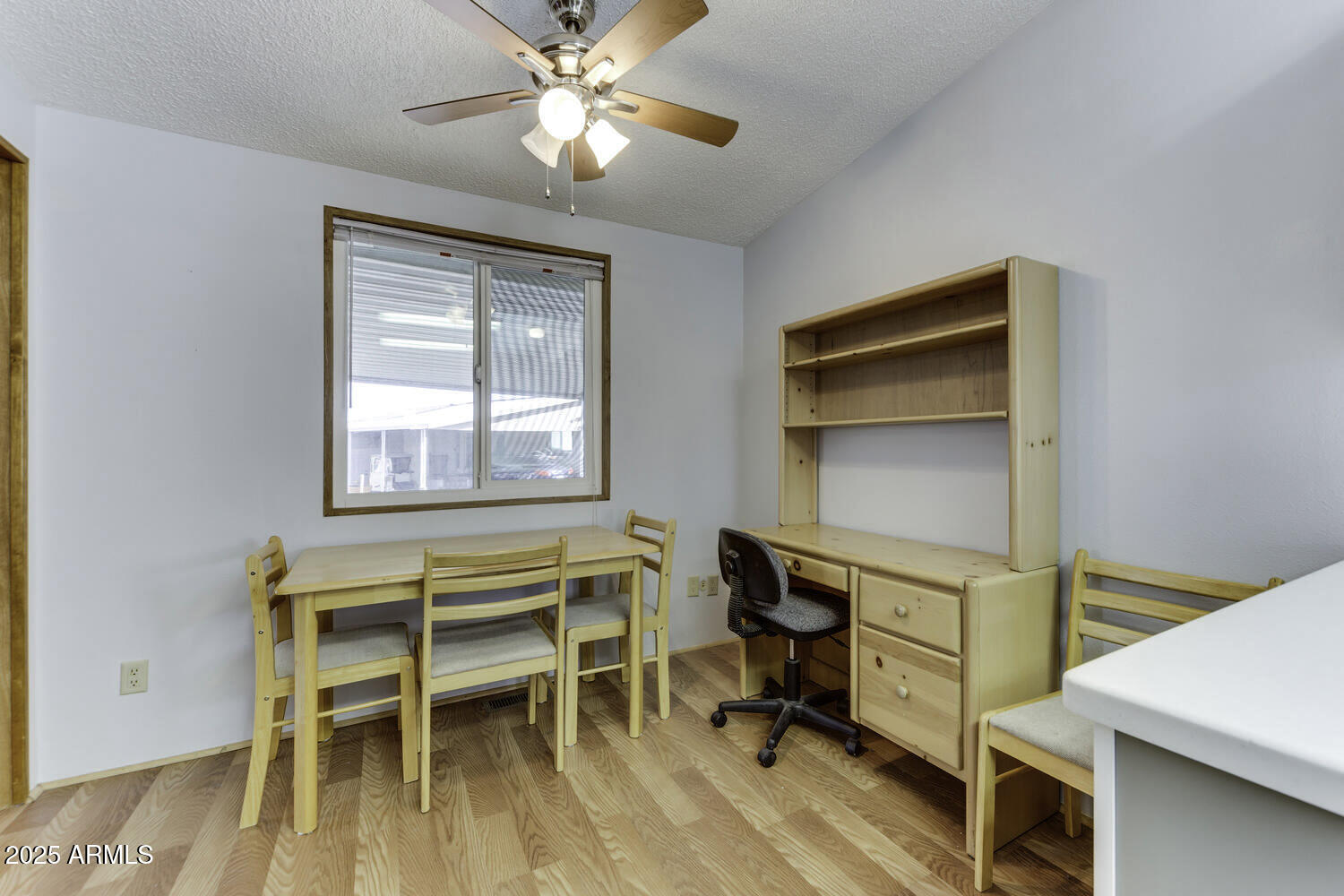 17200 West Bell Road, Unit 1745 Surprise, AZ 85374 - Photo 16 of 24 a view of a workspace with furniture and a window