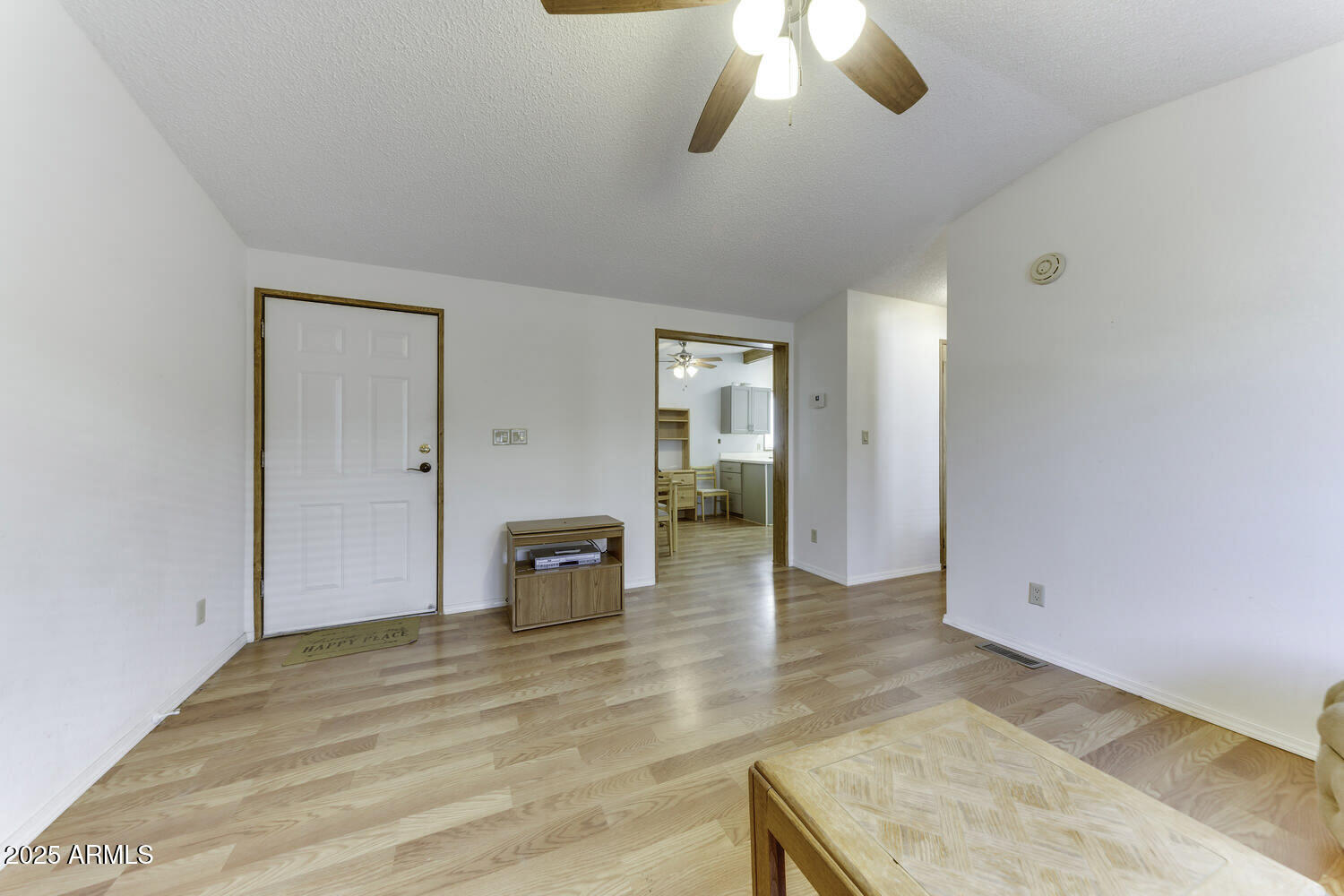 17200 West Bell Road, Unit 1745 Surprise, AZ 85374 - Photo 10 of 24 a view of a livingroom with wooden floor
