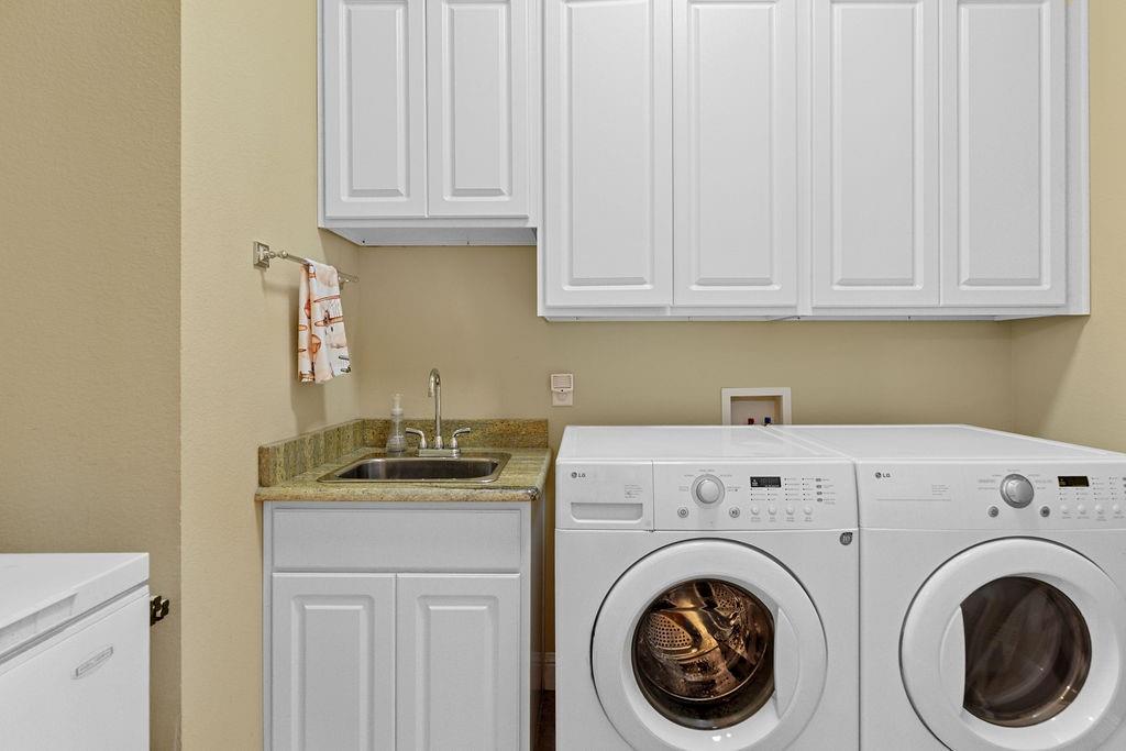 117 Citation Drive Cresson, TX 76035 - Photo 20 of 40 Laundry room featuring separate washer and dryer and cabinet space