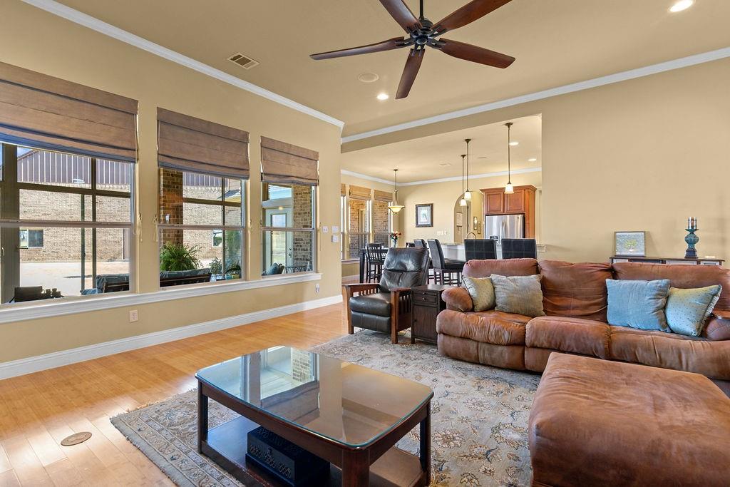 117 Citation Drive Cresson, TX 76035 - Photo 10 of 40 Living room with crown molding, recessed lighting, light wood-style floors, and ceiling fan