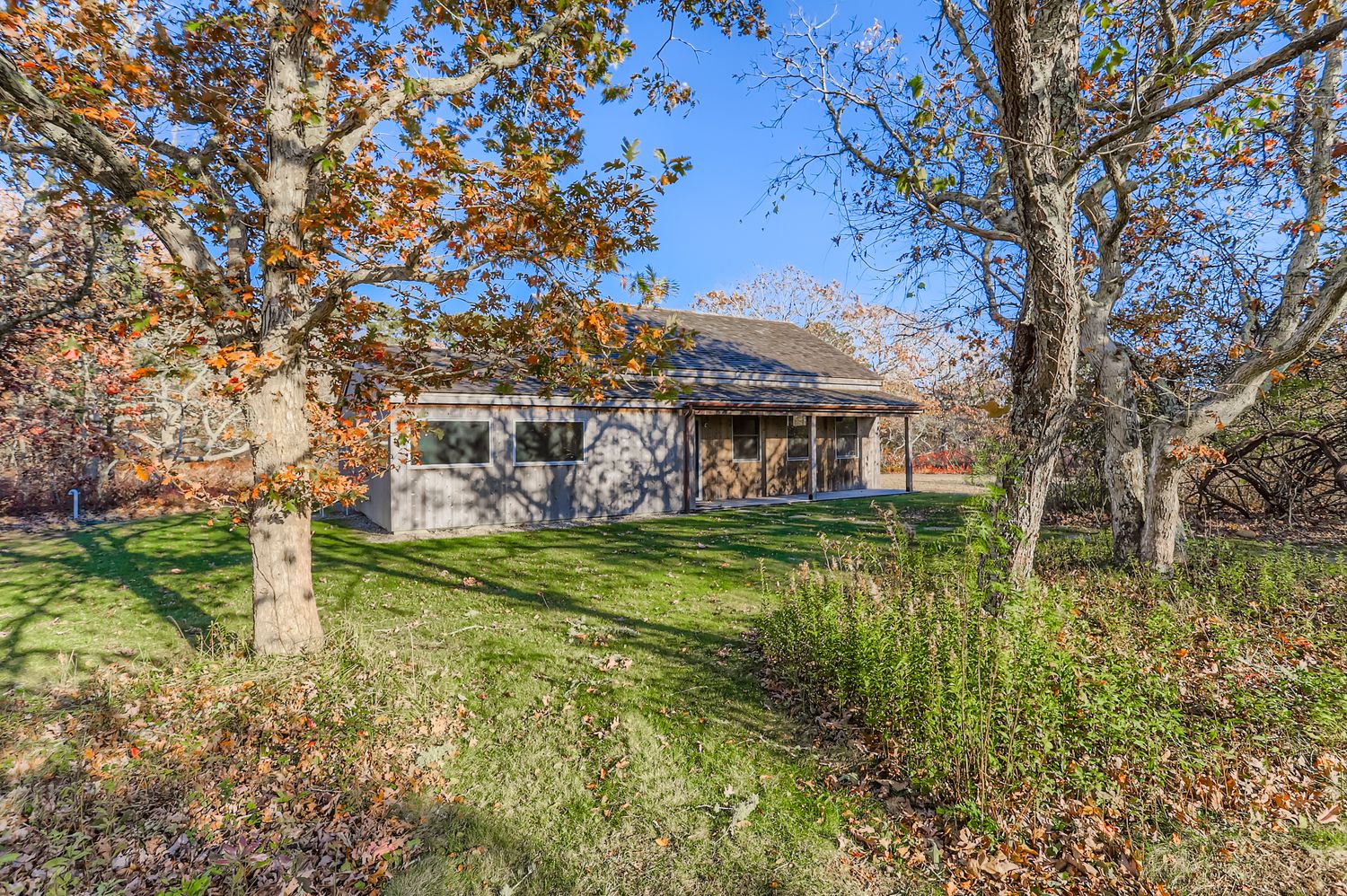 7 Black Point Road Chilmark, MA 02535 - Photo 43 of 48 a view of a house with a big yard and large trees
