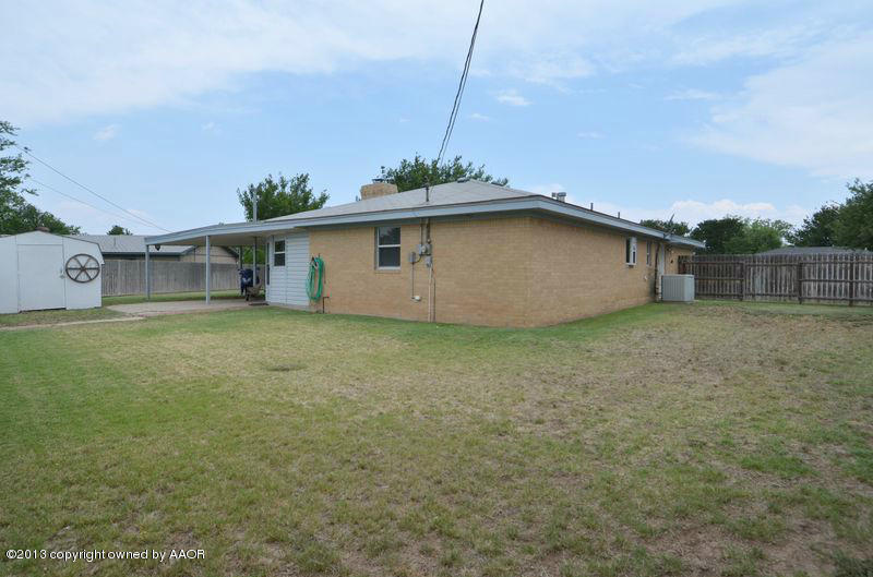 5111 Shield Drive Amarillo, TX 79110 - Photo 21 of 23 a big white house with a big yard and large trees