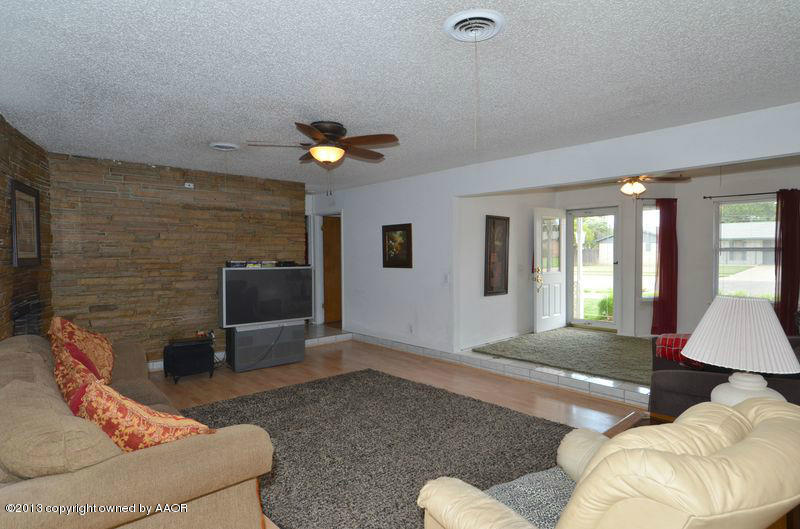 5111 Shield Drive Amarillo, TX 79110 - Photo 3 of 23 a living room with furniture and a flat screen tv