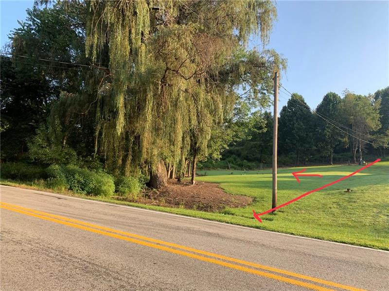 Telephone pole is believed to be near line. to the left of line.  