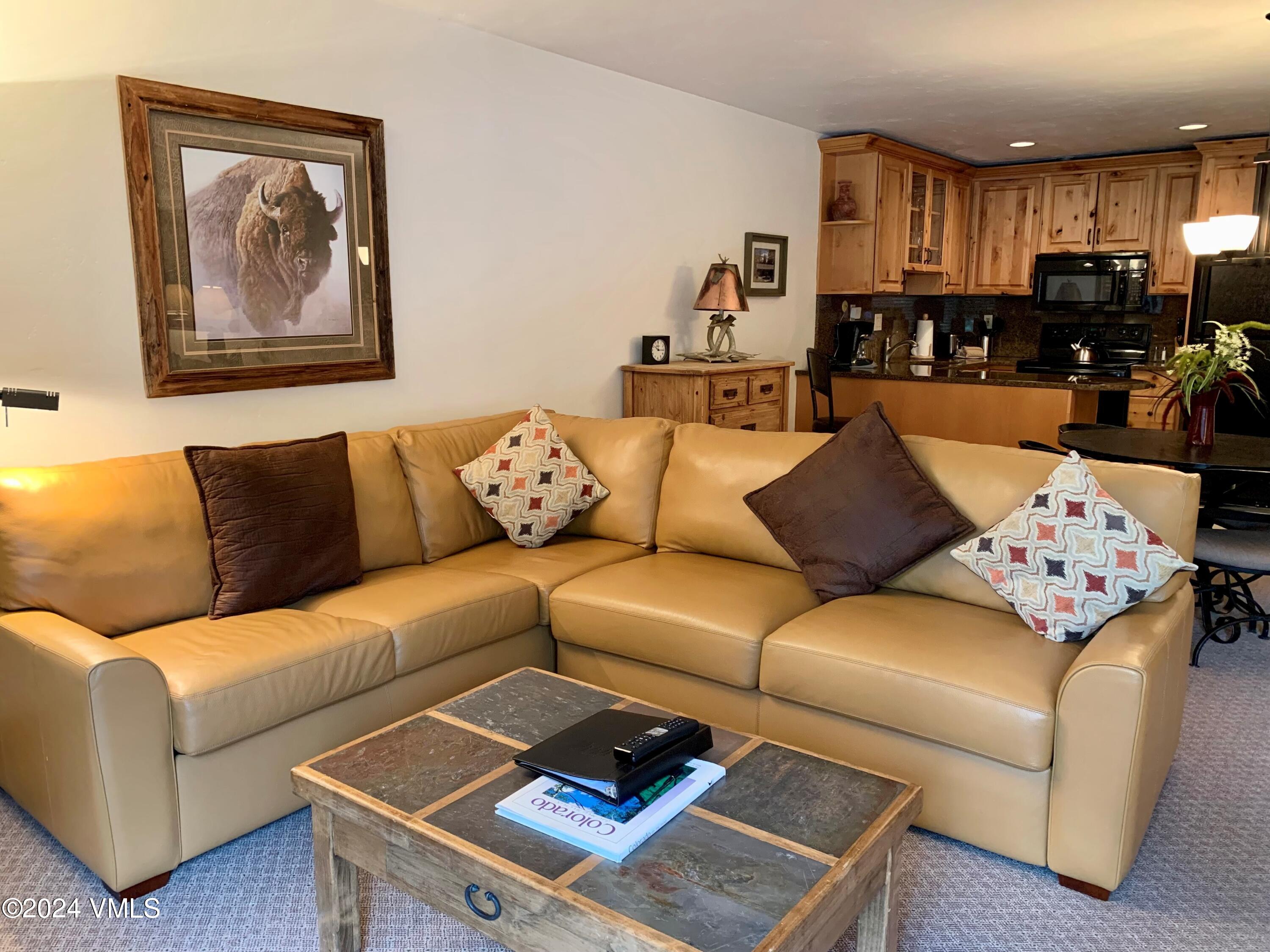 114 Willow Road, Unit 700 Vail, CO 81657 - Photo 2 of 6 a living room with furniture and a couch