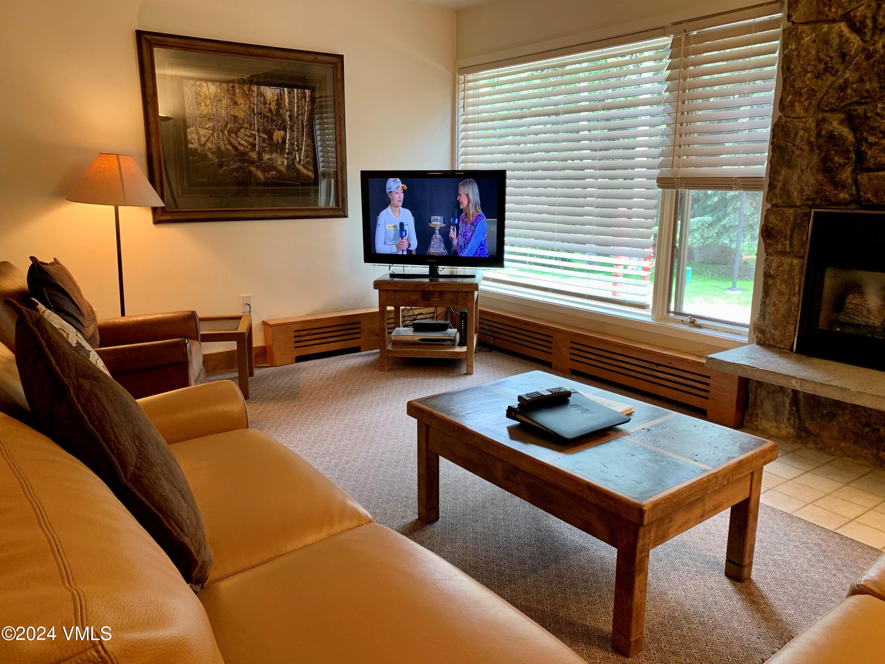 114 Willow Road, Unit 700 Vail, CO 81657 - Photo 3 of 6 a living room with furniture and a window