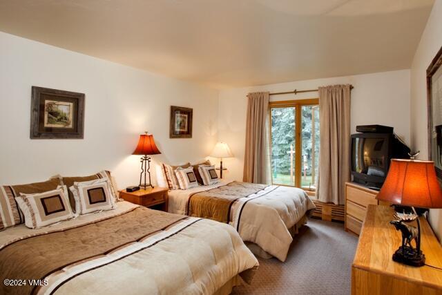 114 Willow Road, Unit 700 Vail, CO 81657 - Photo 4 of 6 a bedroom with two beds and a desk
