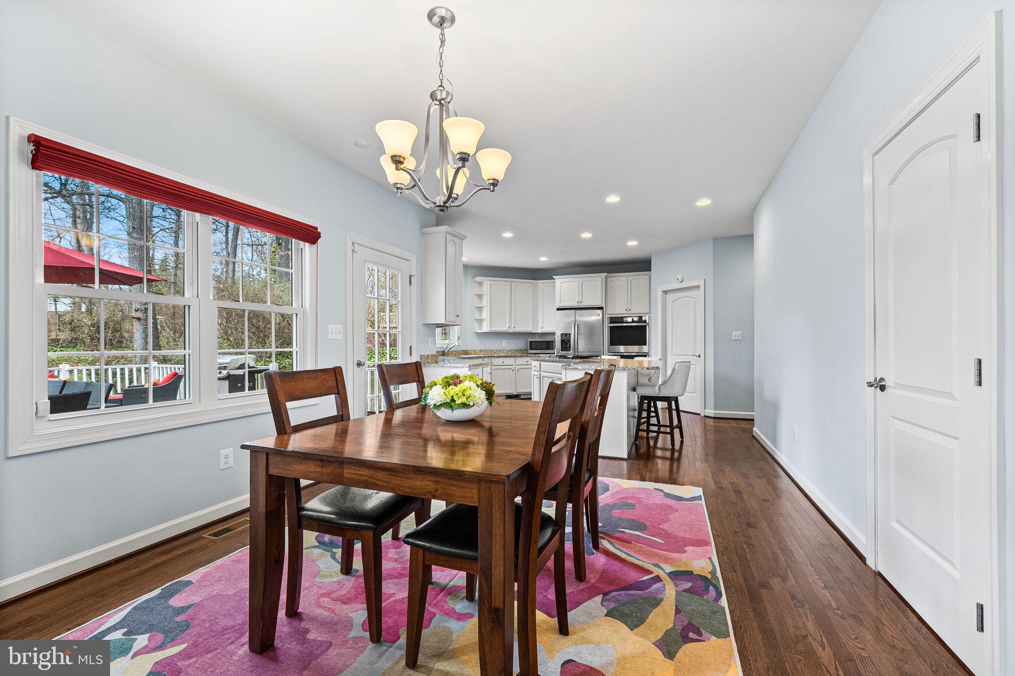 1232 Shenandoah Road Alexandria, VA 22308 - Photo 15 of 50 a view of a dining room with furniture window and wooden floor