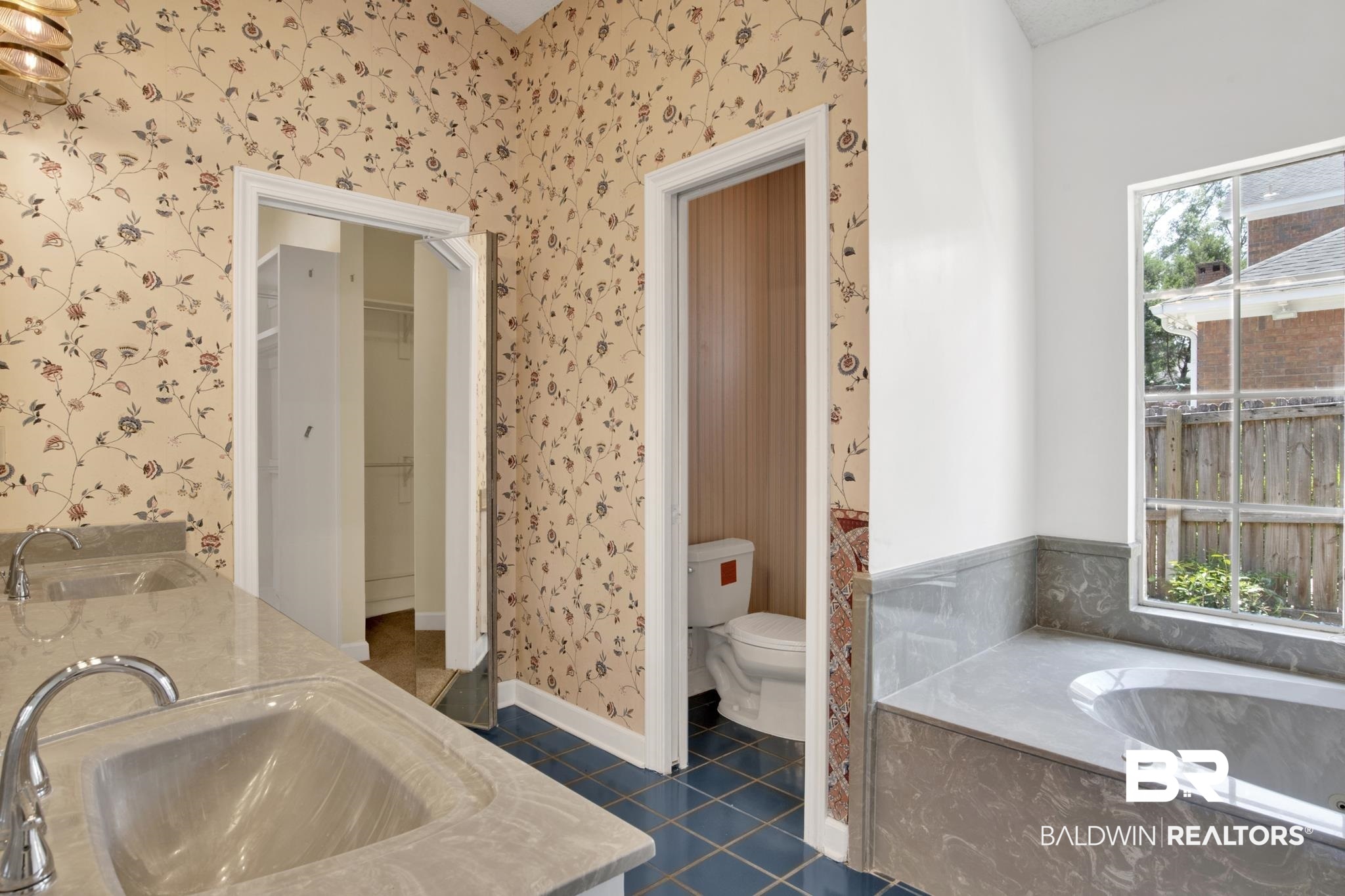 6805 Hunters Court Mobile, AL 36695 - Photo 21 of 37 Full bath featuring wallpapered walls, tile patterned floors, a bath, double vanity, and toilet